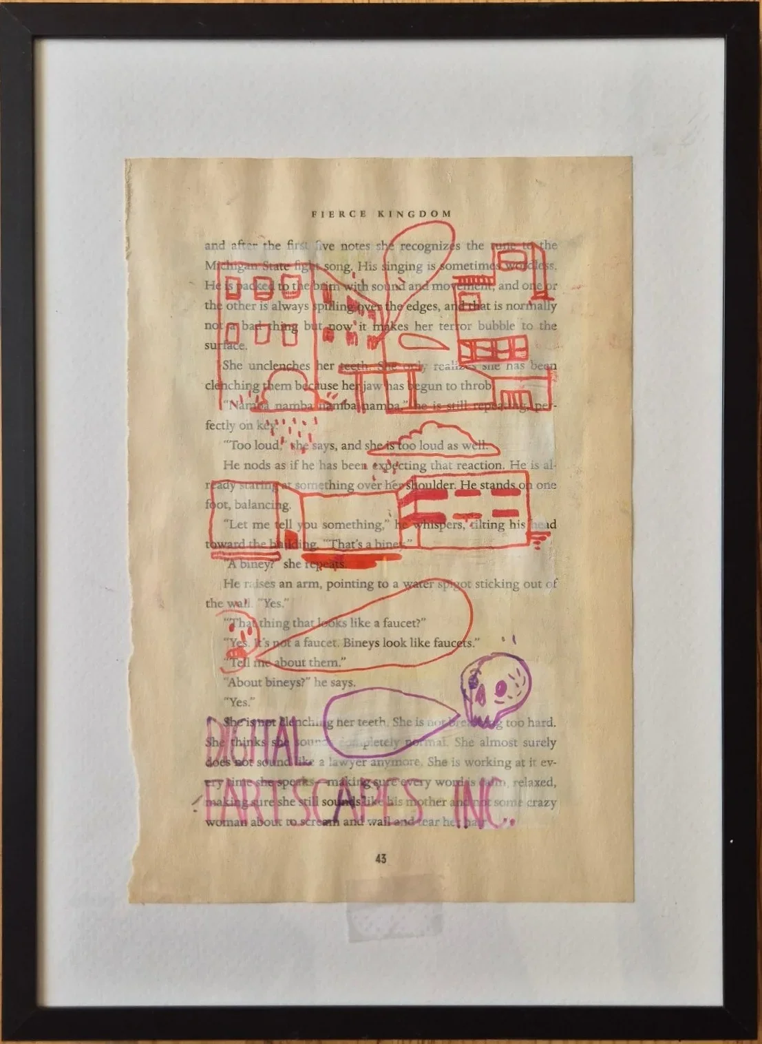 Framed book page from Fierce Kingdom, drawn over in red and purple markers with buildings, a skull face and the words Digital